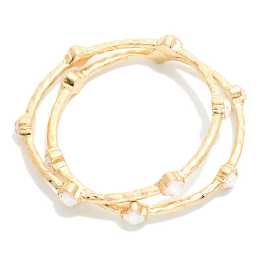 Set Of Two Hammered Metal Tone Bangle Bracelet Featuring Glitter Resin Clover